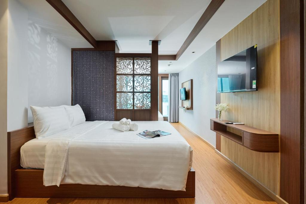 Postel nebo postele na pokoji v ubytování Elite Luxury Hotel