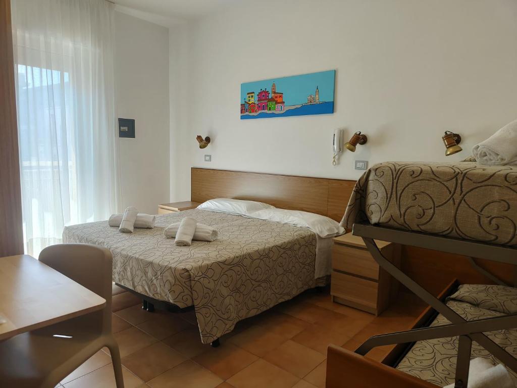 Postel nebo postele na pokoji v ubytování Hotel Anna