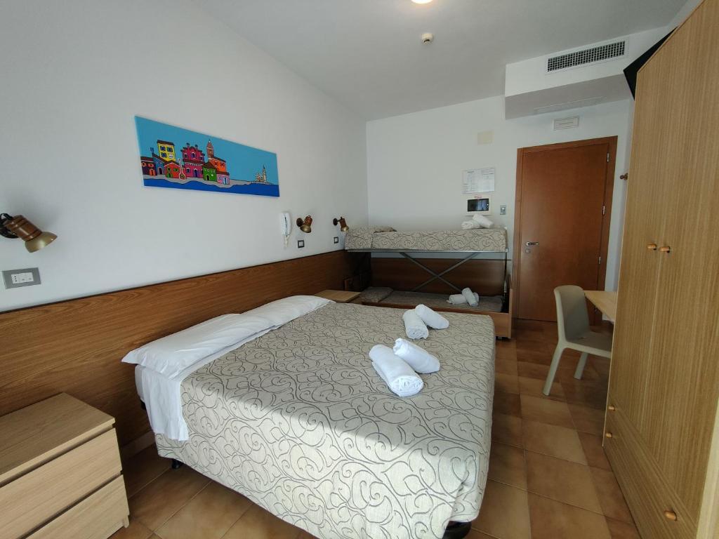 Postel nebo postele na pokoji v ubytování Hotel Anna