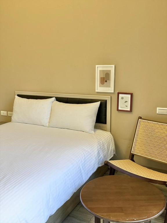 Postel nebo postele na pokoji v ubytování Kaile Roaming Homestay