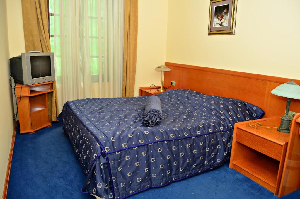 Krevet ili kreveti u jedinici u okviru objekta Garni Hotel Park