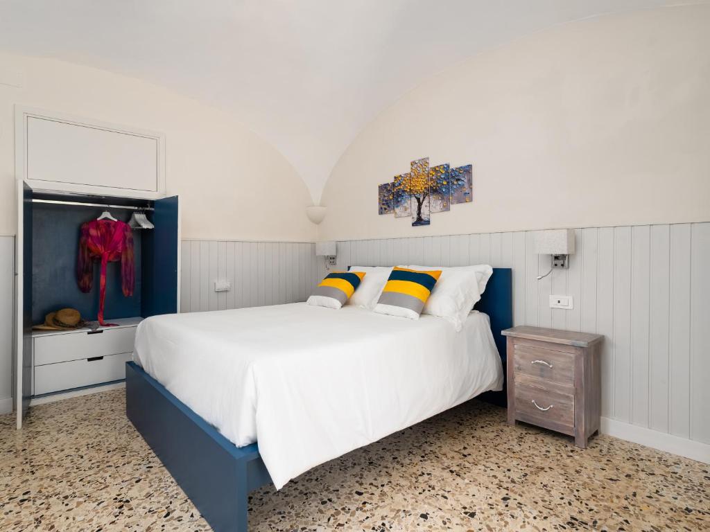 a blue and white bedroom with a large bed at EMMEhouse in Sant'Agnello