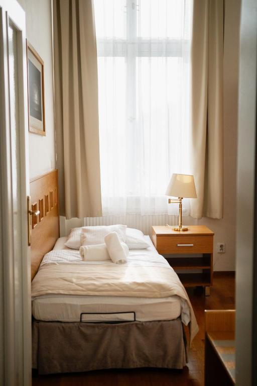 Postel nebo postele na pokoji v ubytování Hotel Pod Zeleným Dubem