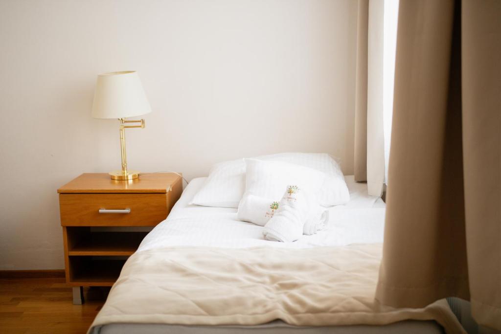 Postel nebo postele na pokoji v ubytování Hotel Pod Zeleným Dubem