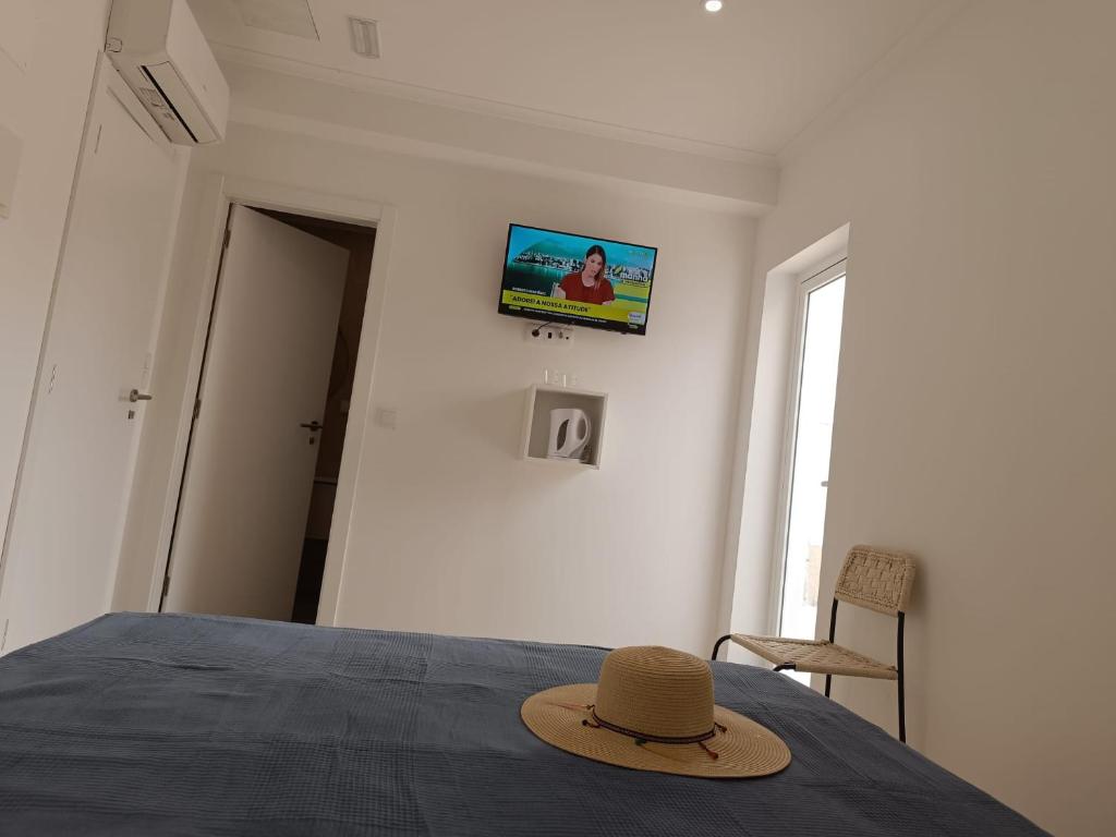 Ένα ή περισσότερα κρεβάτια σε δωμάτιο στο Riad'a Praia