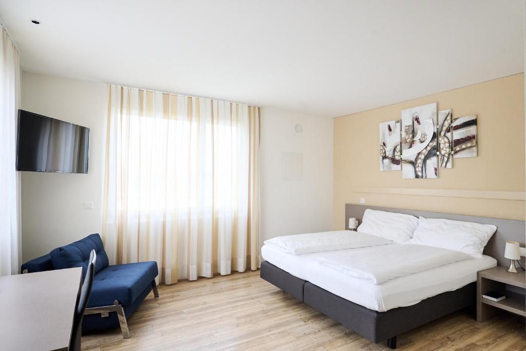 Postel nebo postele na pokoji v ubytování Smart Hotel Kreisel --Self check-In