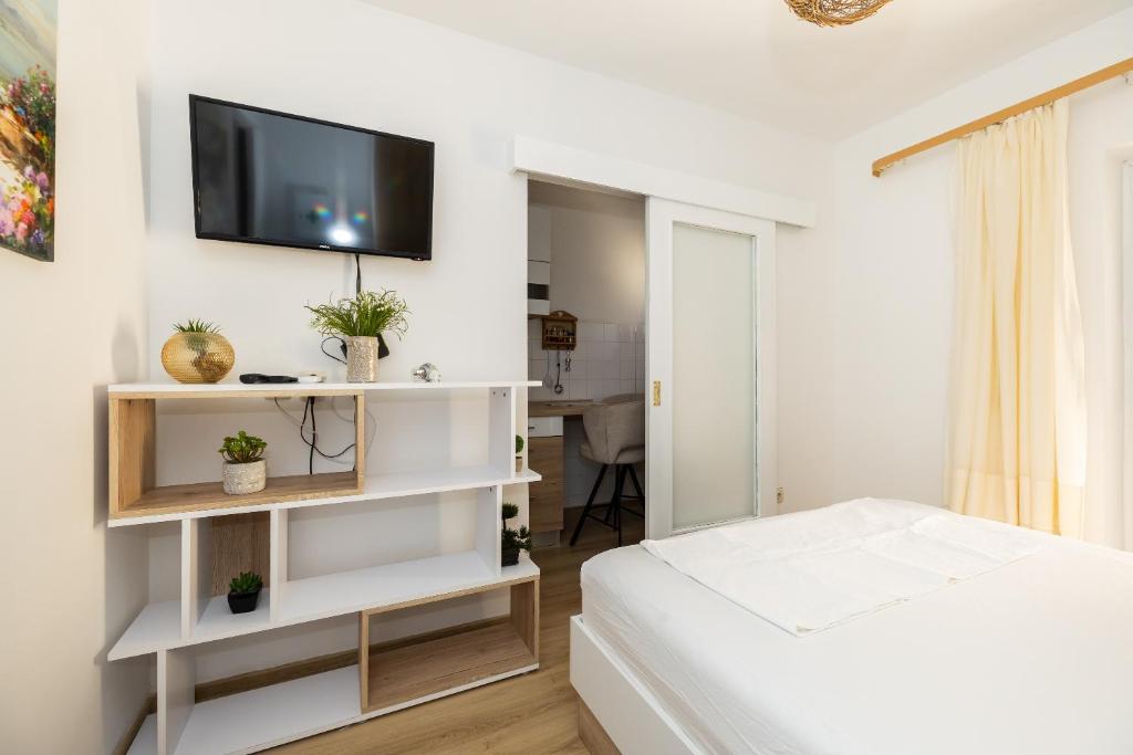 Posteľ alebo postele v izbe v ubytovaní tiho's apartments