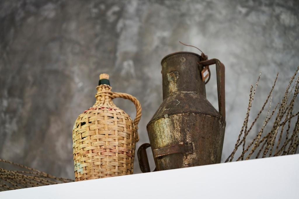two vases sitting on top of a white shelf at Sparrow Sintra Nest in Sintra