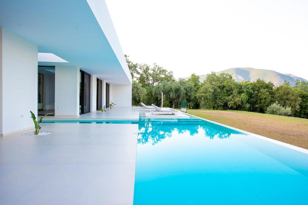 an image of a swimming pool in a house at The Oasis, luxury Villa in Nidri in Palaiokatoúna