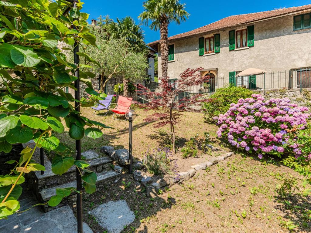 a garden in front of a building at Holiday Home Angela by Interhome in Perledo