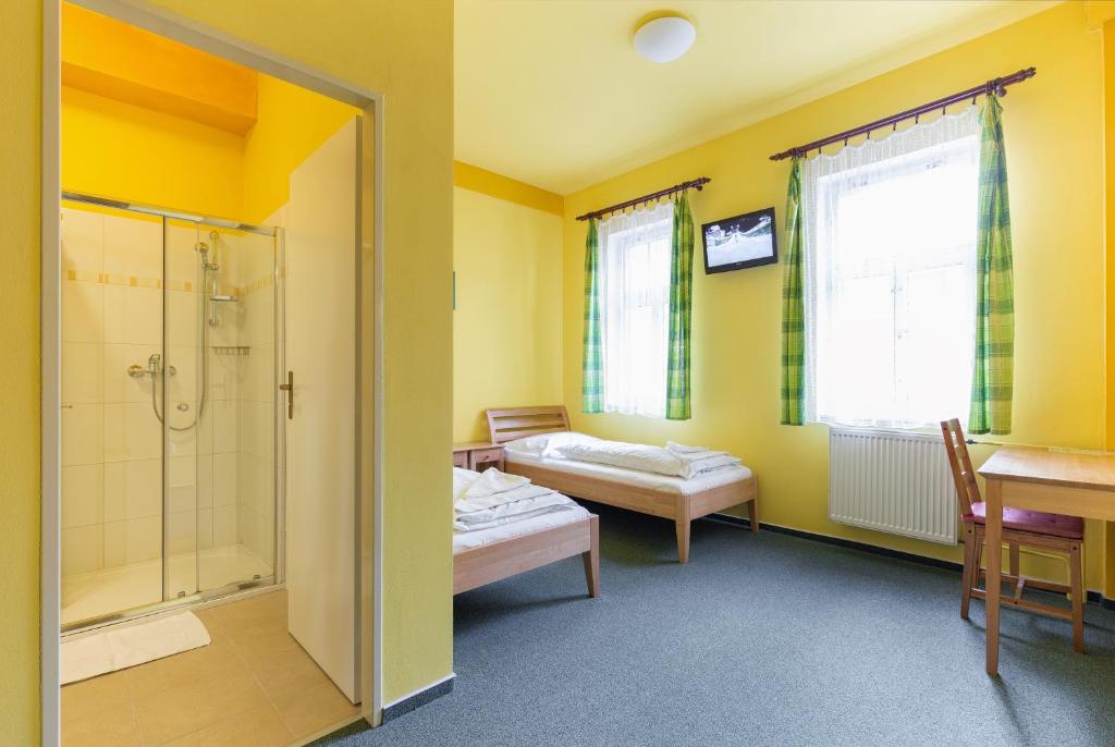 Postel nebo postele na pokoji v ubytování Hotel U Salzmannů