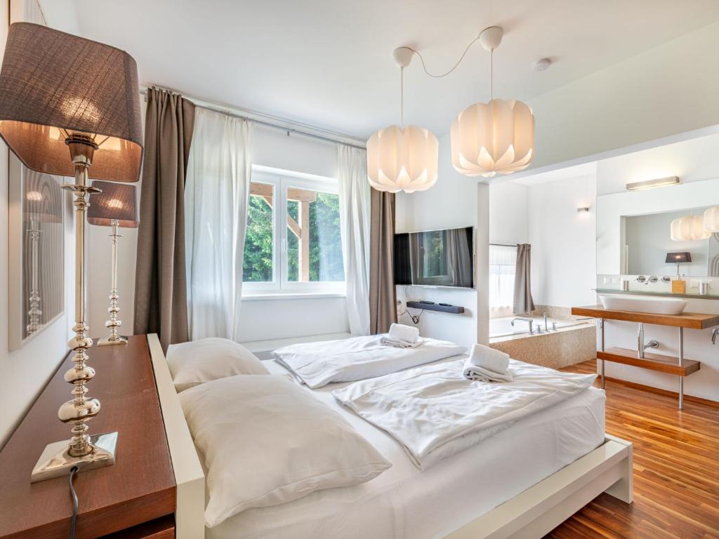 Postel nebo postele na pokoji v ubytování Apartment Simonhöhe Kärntentraum-1 by Interhome