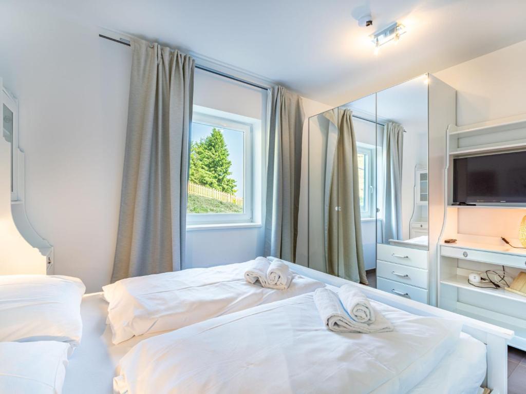 Postel nebo postele na pokoji v ubytování Apartment Simonhöhe Kärntentraum-1 by Interhome