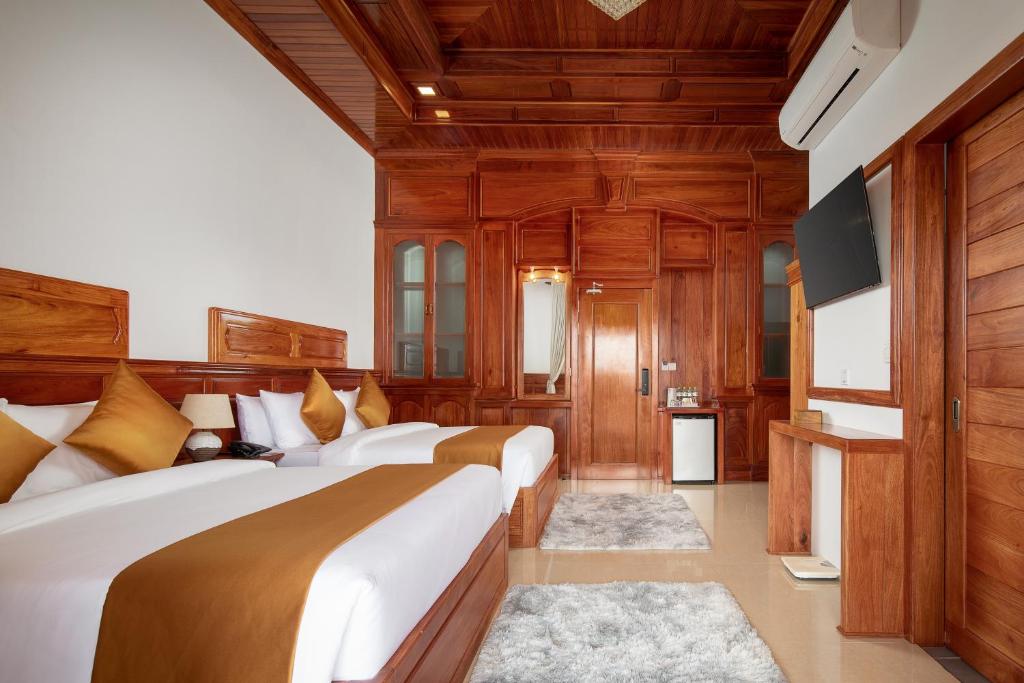 Postel nebo postele na pokoji v ubytování Seyna Residence