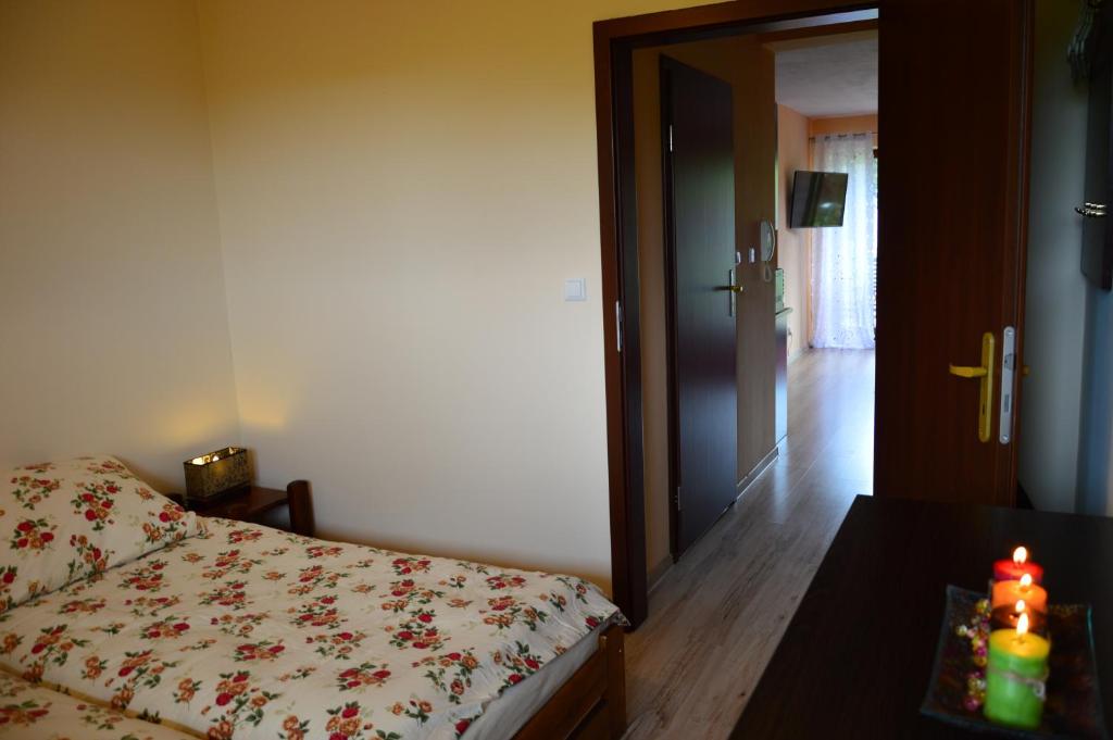 Posteľ alebo postele v izbe v ubytovaní Nostalgiczne Kościelisko Apartament & SPA