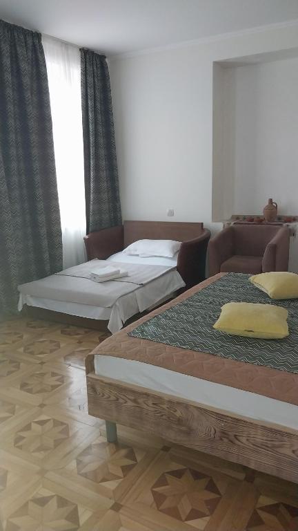 Postel nebo postele na pokoji v ubytování VIGOR