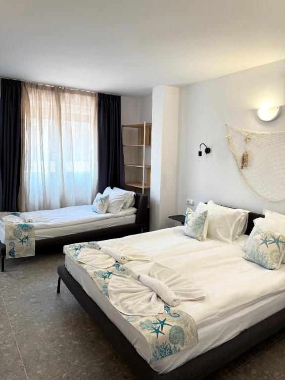 Postel nebo postele na pokoji v ubytování Hotel Mistral