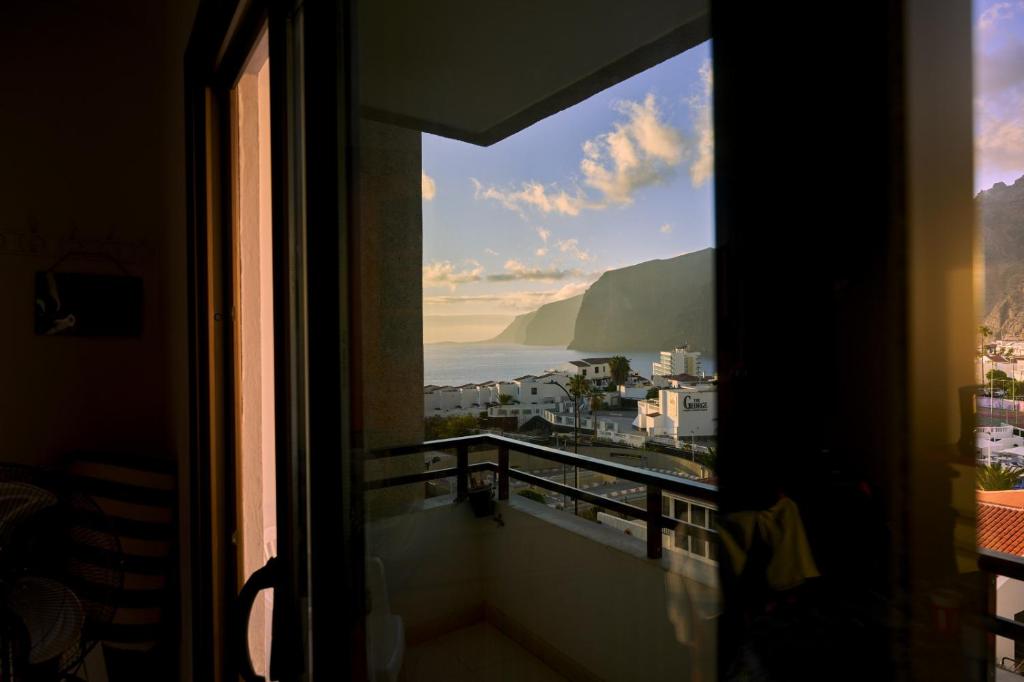 a view of the ocean from a window at CasitaRino in Puerto de Santiago