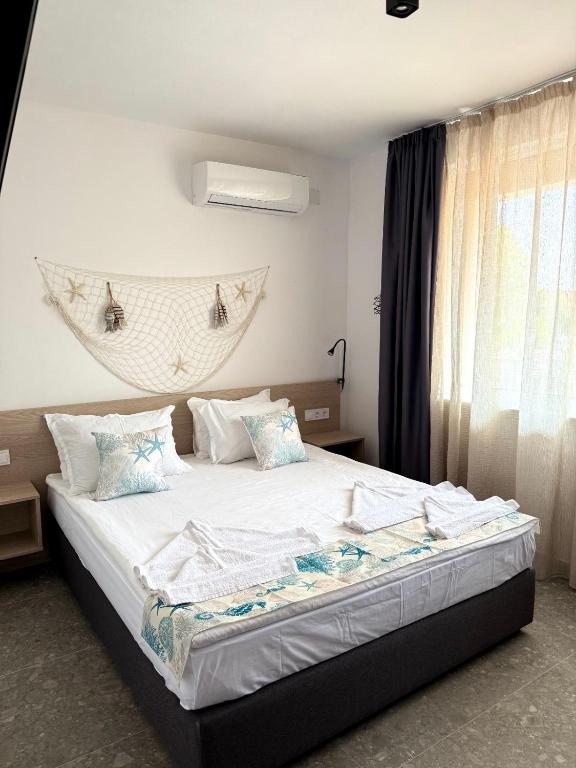 Postel nebo postele na pokoji v ubytování Hotel Mistral