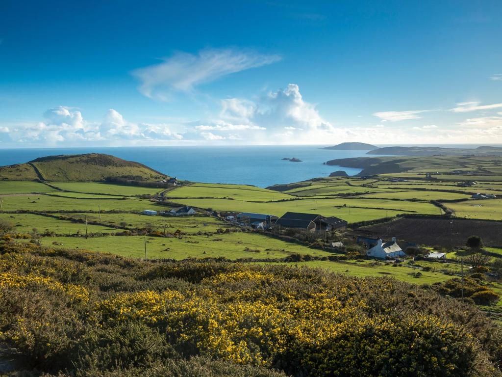 a view of the mendocino hills and the ocean at Rhiw 2 Bryn Tirion in Rhiw