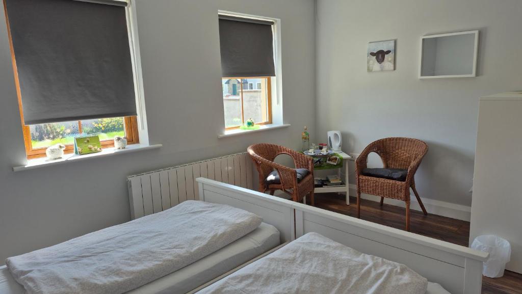 Postel nebo postele na pokoji v ubytování Sheepviewhouse Jamie