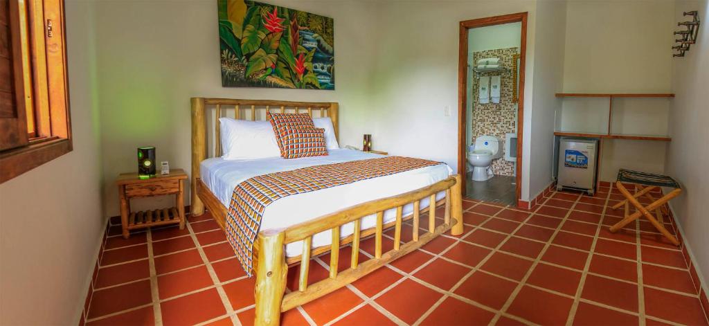 Postel nebo postele na pokoji v ubytování Hotel Brisas La Gaviota Mariquit-Tolima