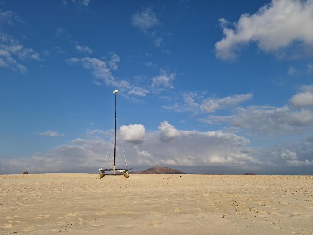 a object sitting in the sand on a beach at "Sun down" by Corralejobeach Apartments in Corralejo