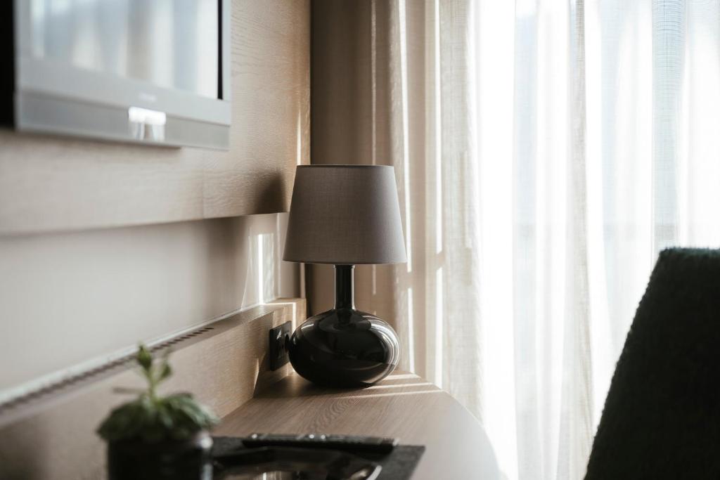 TV a/nebo společenská místnost v ubytování Boutiquehotel Minigolf
