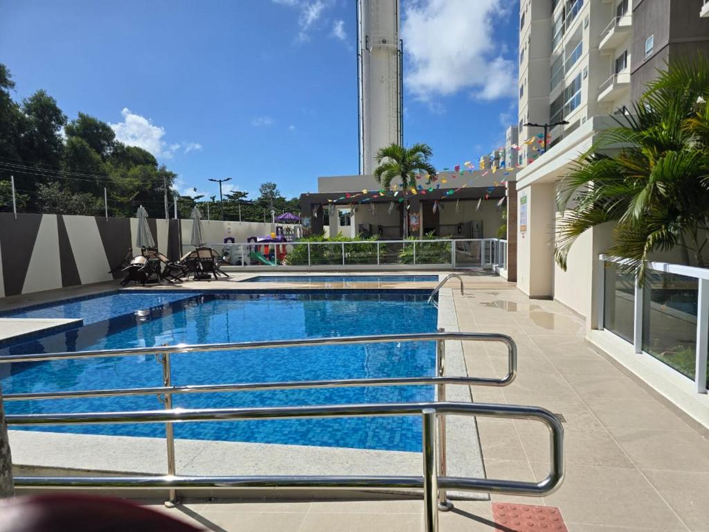 a swimming pool in the middle of a building at Apartamento Residencial Serigy in Aracaju