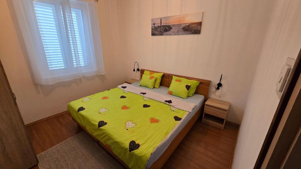 Posteľ alebo postele v izbe v ubytovaní Apartman Juraga
