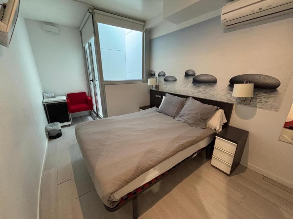 Postel nebo postele na pokoji v ubytování Hotel Punta Monpas