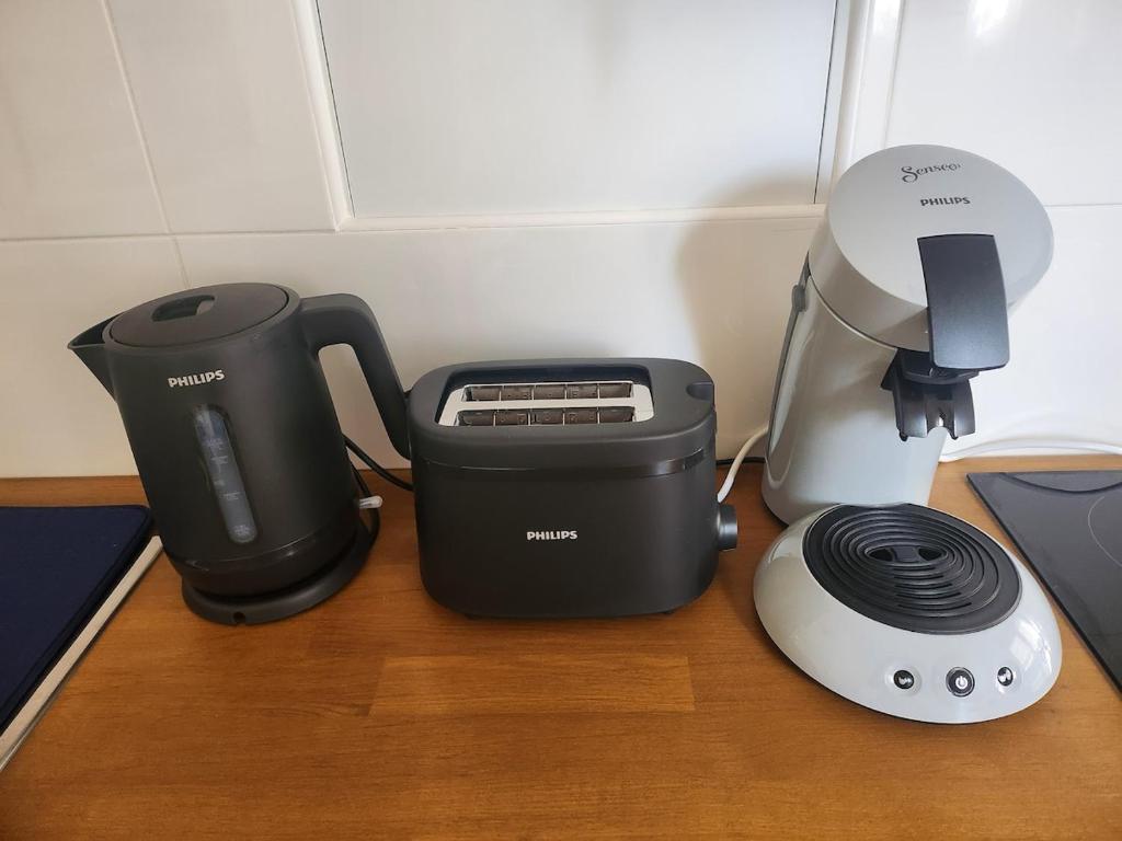 a coffee maker and a blender on a table at Sun Studio - 2 people - City Center in Charleville-Mézières