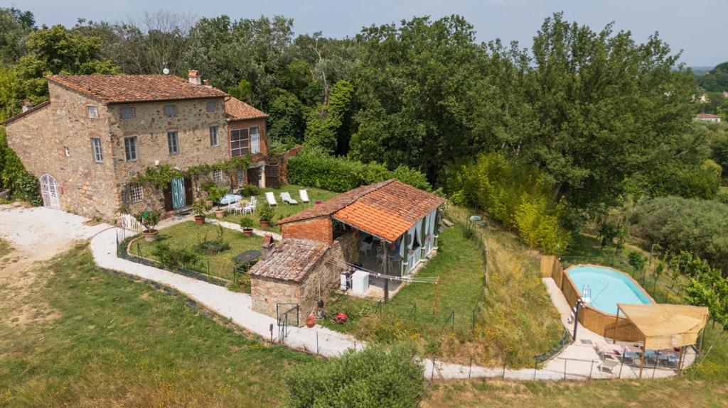 an aerial view of a house with a swimming pool at Villa Isabò by VacaVilla in Capannori