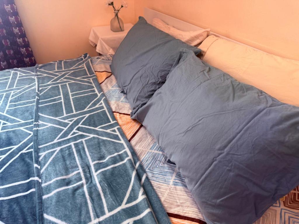 Postel nebo postele na pokoji v ubytování BlessyWail Homestay