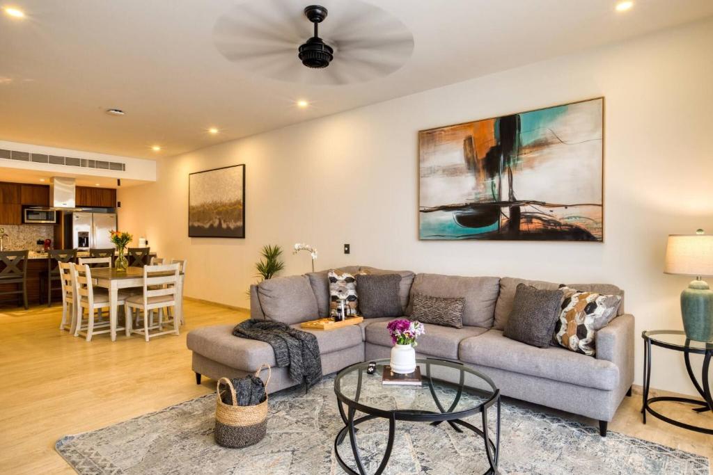 a living room with a couch and a table at For couples, petfriendly 2 BR ocean view 18 4pax in Cabo San Lucas