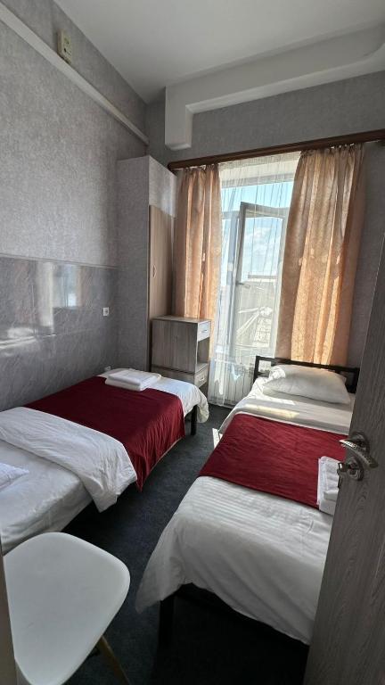 Postel nebo postele na pokoji v ubytování Hotel Erebuni Plaza