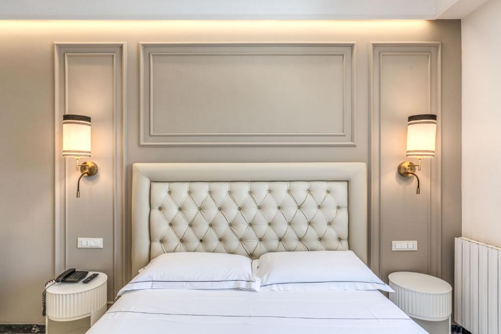 Łóżko lub łóżka w pokoju w obiekcie Hotel Castel Vecchio