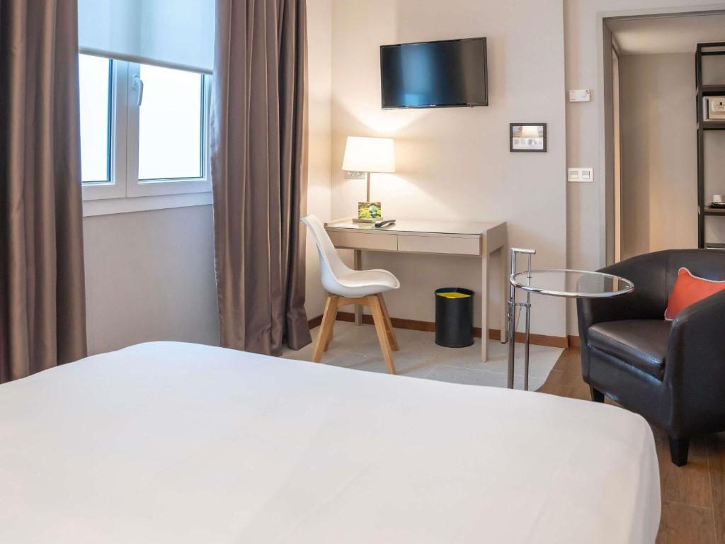 Postel nebo postele na pokoji v ubytování Mercure Monte Igueldo