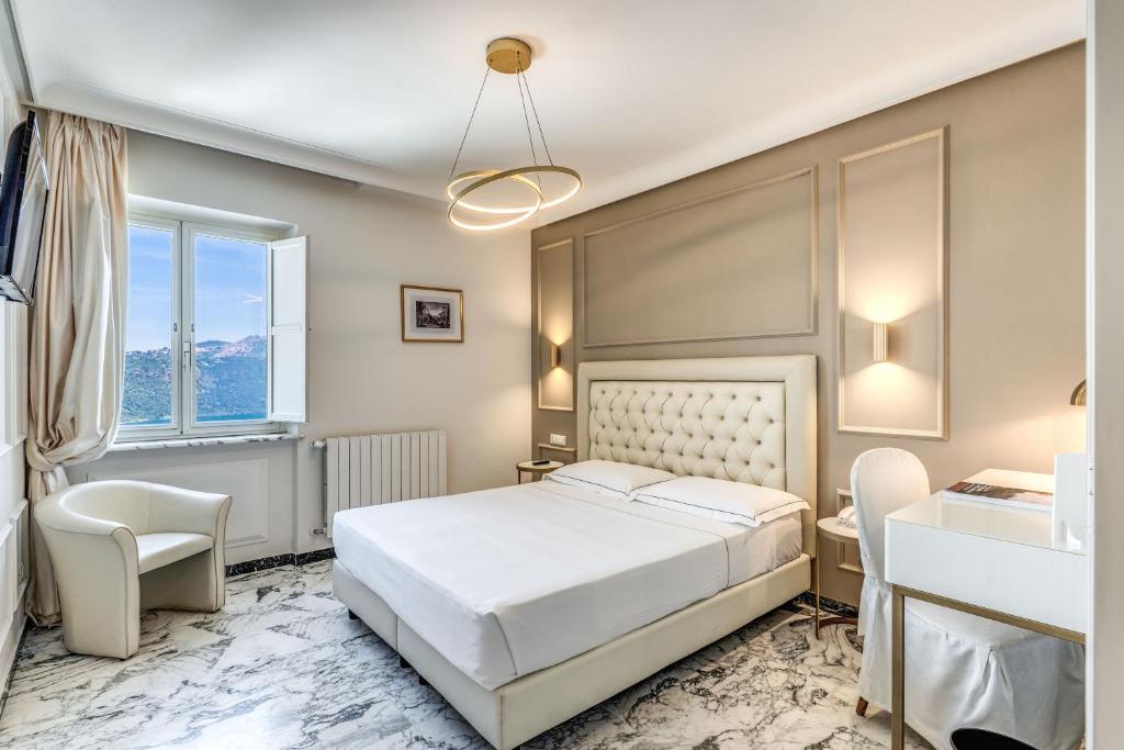 Łóżko lub łóżka w pokoju w obiekcie Hotel Castel Vecchio