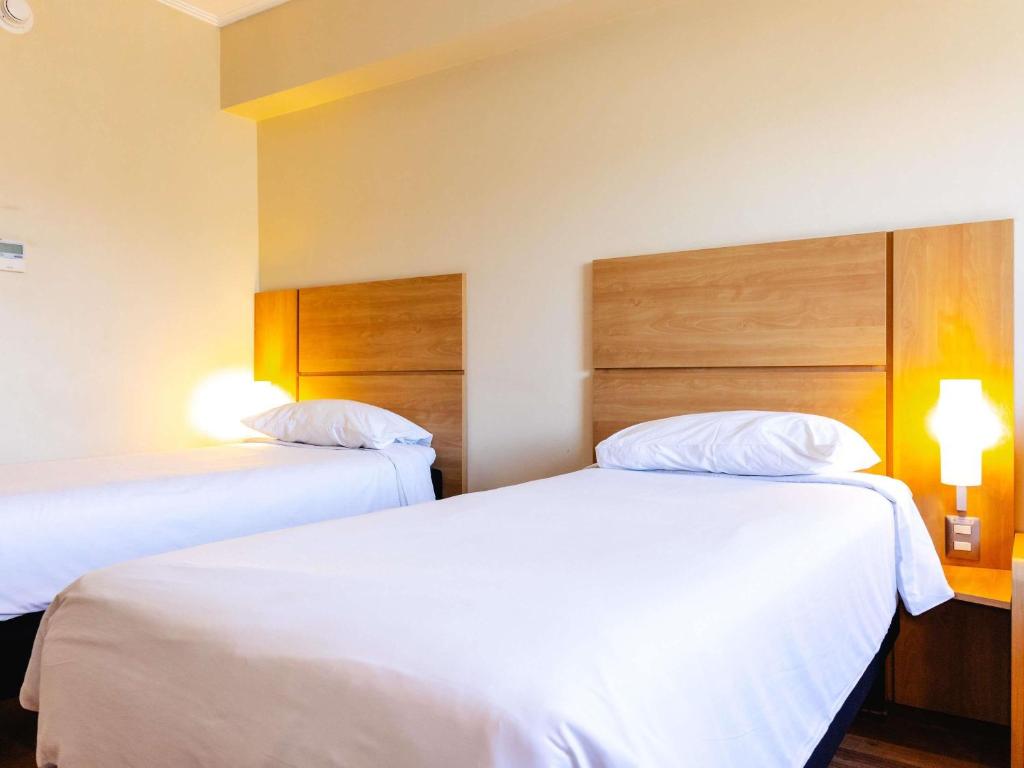Postel nebo postele na pokoji v ubytování ibis Valparaiso