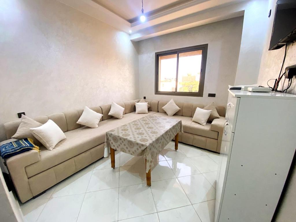 a living room with a couch and a table at Prime Location, Budget Friendly Studio in Central 