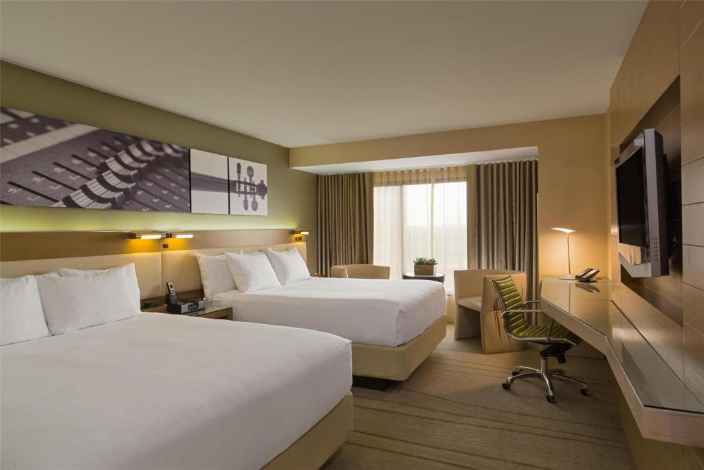Postel nebo postele na pokoji v ubytování Hyatt Regency Austin