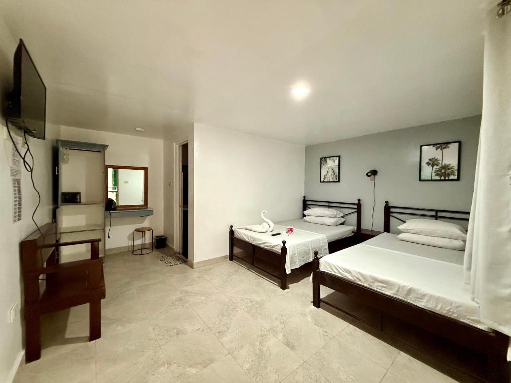 Postel nebo postele na pokoji v ubytování Marion Roos Hotel