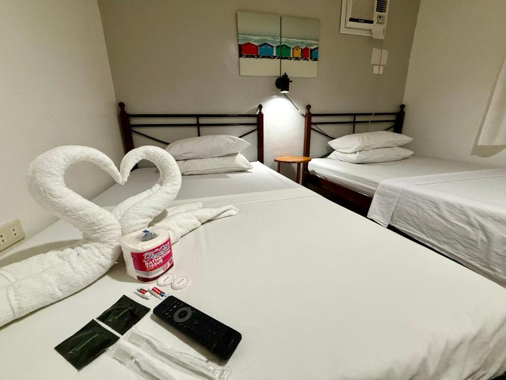Postel nebo postele na pokoji v ubytování Marion Roos Hotel