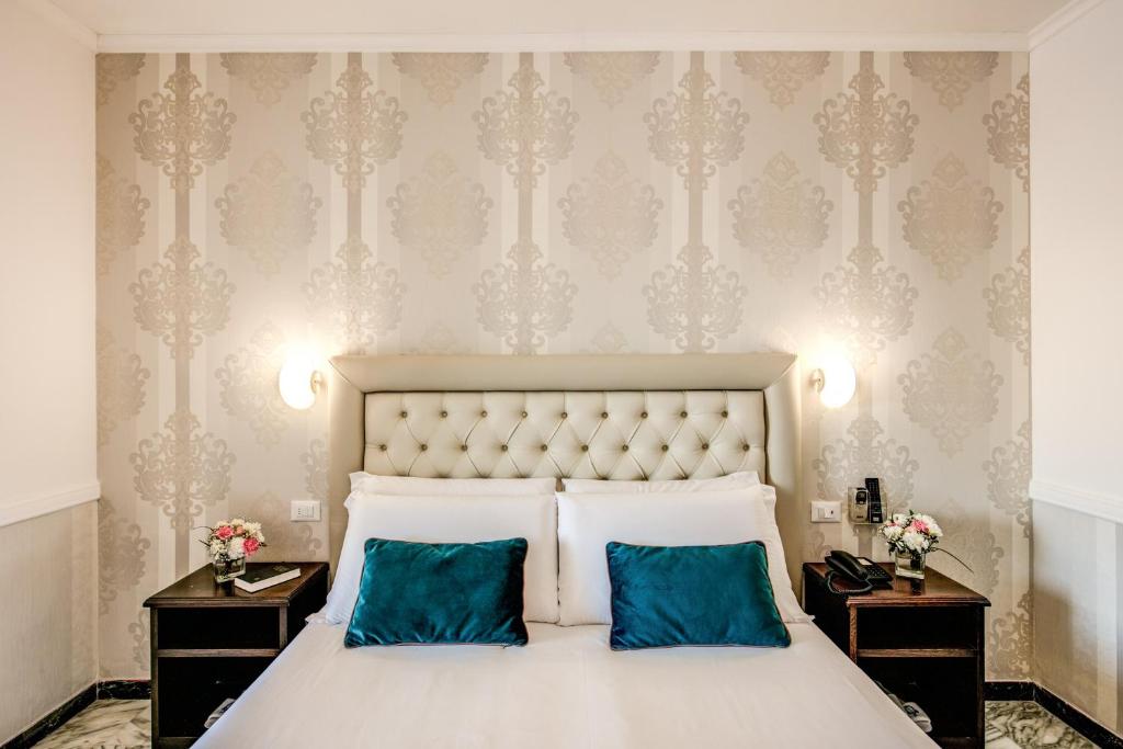 Łóżko lub łóżka w pokoju w obiekcie Hotel Castel Vecchio