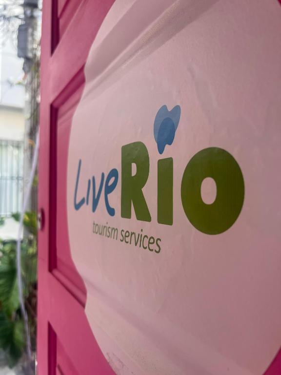 a sign for a live red british services at LiveRio Hostel Ipanema in Rio de Janeiro