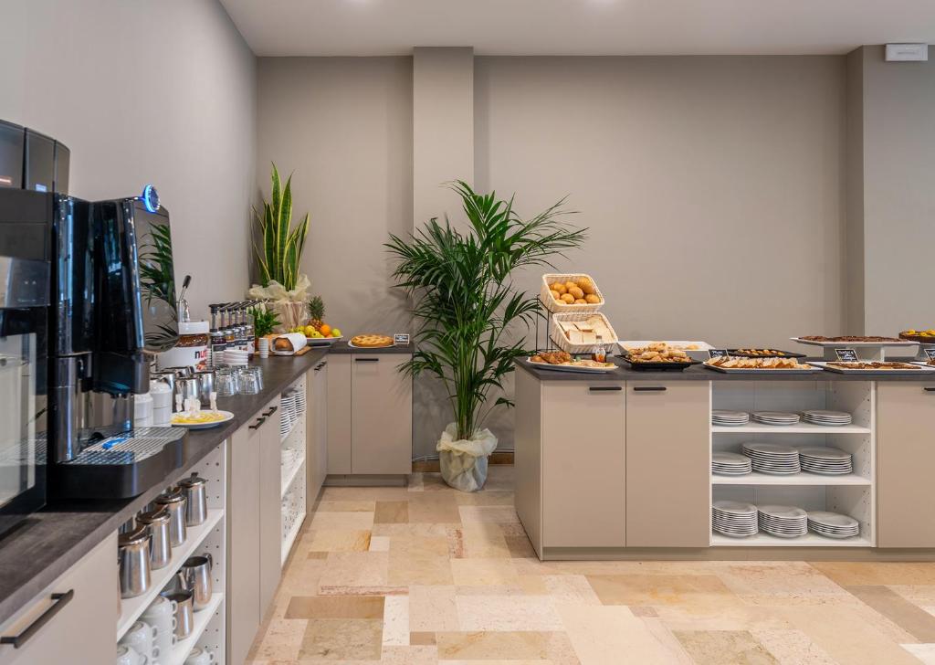 Kuchyň nebo kuchyňský kout v ubytování Hotel Acropolis