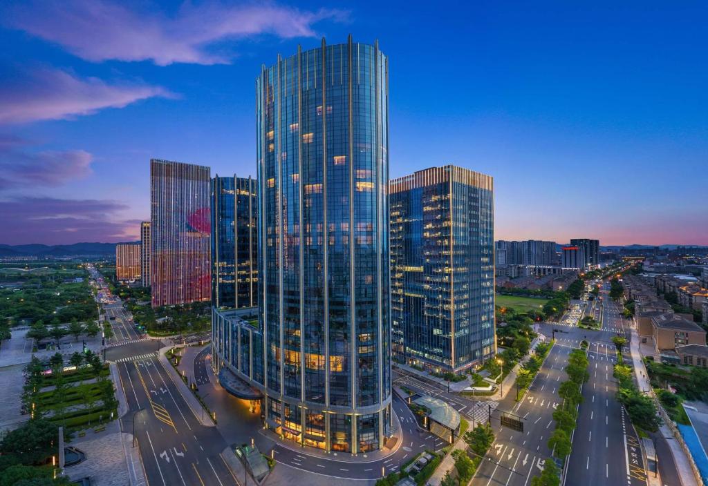 an overhead view of a tall building in a city at Ramada by Wyndham Hangzhou Yuhang in Hangzhou