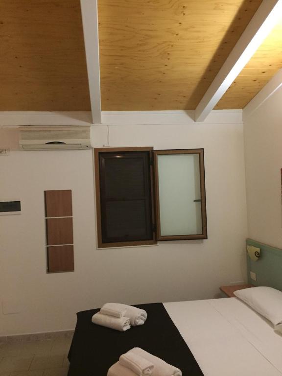 Postel nebo postele na pokoji v ubytování Hotel Universo