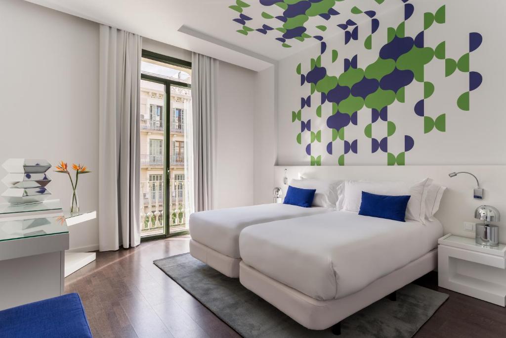 Postel nebo postele na pokoji v ubytování Room Mate Carla, Barcelona